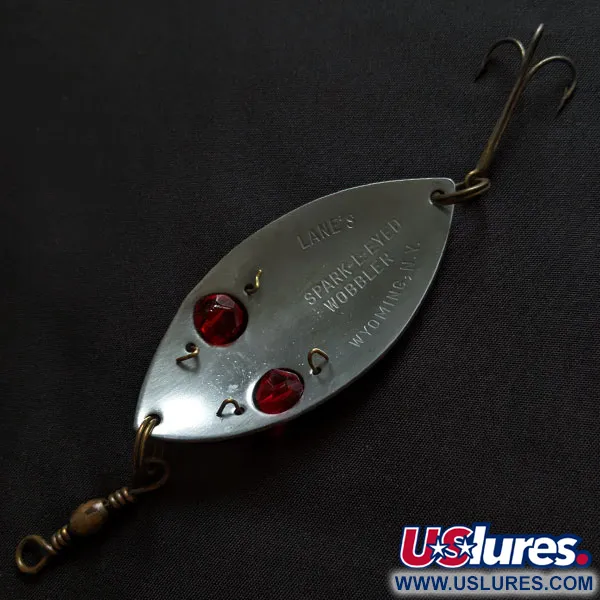 Lanes Tackle & Bait Lane's Spark-l-eyed wobbler, 25g, nikelis / raudonos akys, svyruojanti blizgė #18372