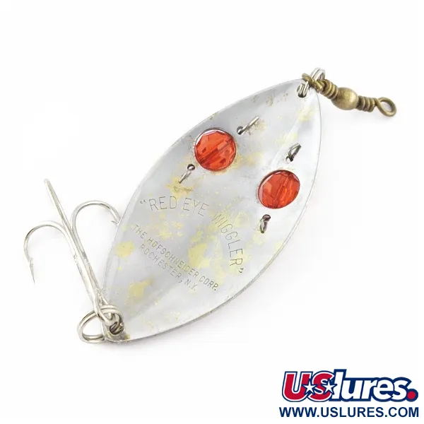 Hofschneider Red Eye Wiggler, 25g sidabrinė/žalvarinė su raudonomis akimis, vartiklė #24361