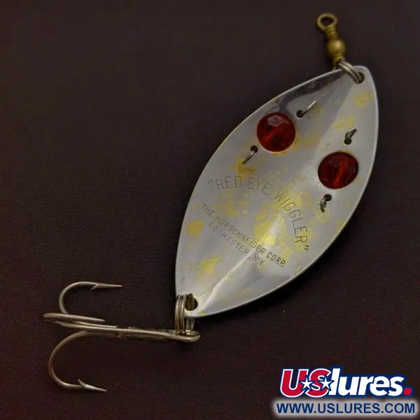 Hofschneider Red Eye Wiggler, 25g sidabrinė/žalvarinė su raudonomis akimis, vartiklė #24361